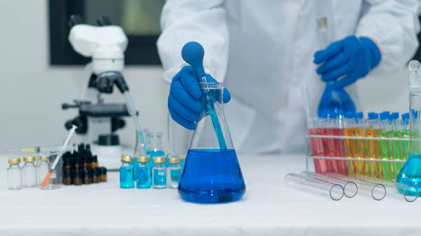 istock Researchers, doctors, scientists work with plastic medical tubes in modern laboratories or hospitals. Biotechnology Expert On Advanced Equipment Chemistry Lab Medicine Experiment For Hospital 1376071604