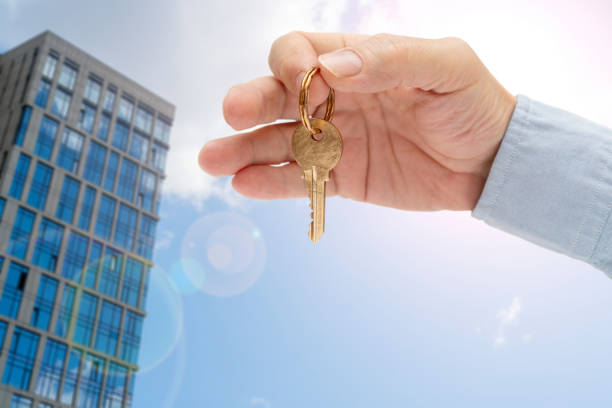istock Apartment key in a man's hand. 1376081404