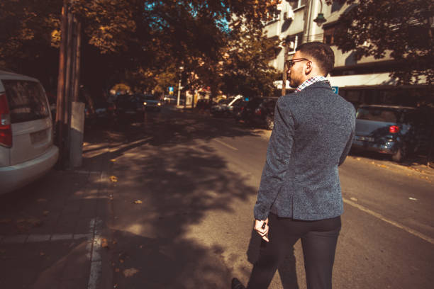 istock A guy walking the street and looking around 1376085845