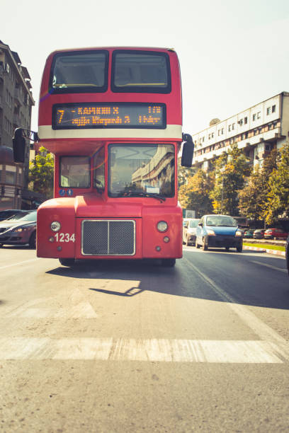 istock A double-decker bus driving in the city 1376086847