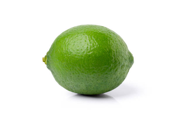 istock Green lime fruit isolated on white 1376088713