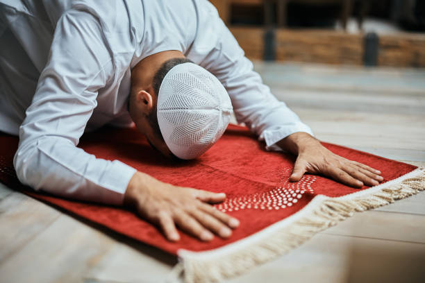 istock Muslim man praying at home. 1376091259