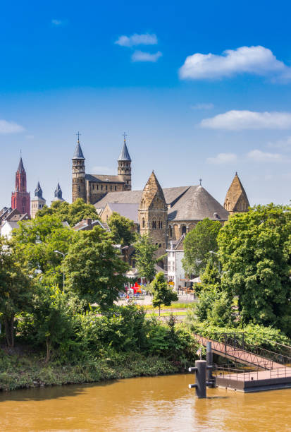 Three churches at the Maas river in Maastricht stock photo