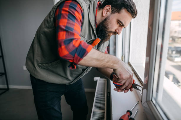 istock Handyman fixing the window 1376098704