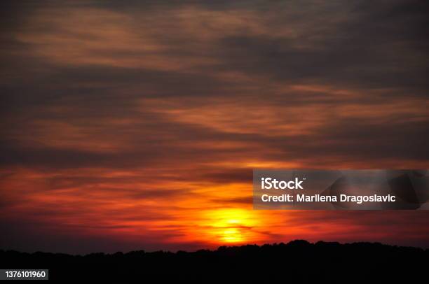 Red Sunset Sky Blow And Horizon Nature Backgroundsilhouette Sunset With Orange Sky With Clouds At Dusk And High Space Stock Photo - Download Image Now