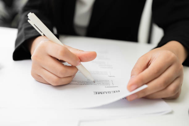 istock Close up hand business woman manager checking documents reports papers company application form or registering claim contract documents in office. 1376103732