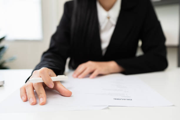 istock Close up hand business woman manager checking documents reports papers company application form or registering claim contract documents in office. 1376103991