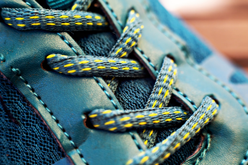 Shoe lace on blue shoe