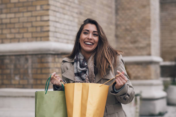 istock A young woman is looking inside her shopping bag. 1376117585
