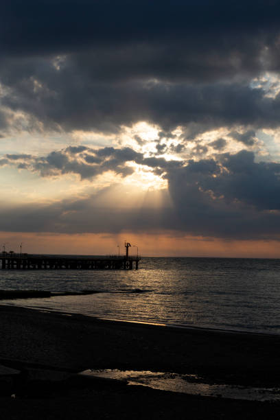 istock Seascape at sunset. Lighthouse on the coast 1376123815