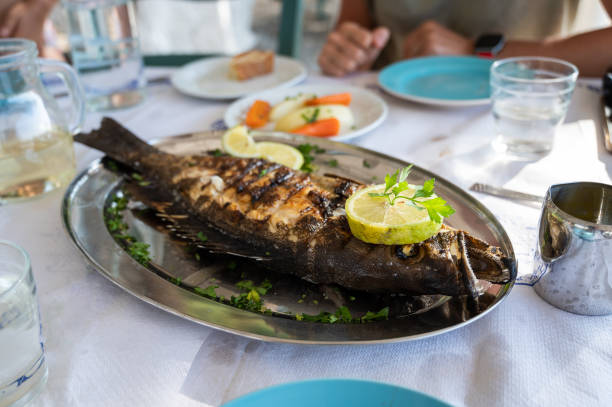 istock Grilled grouper fish on a silver plate in a restaurant in Crete, Greece. 1376124357