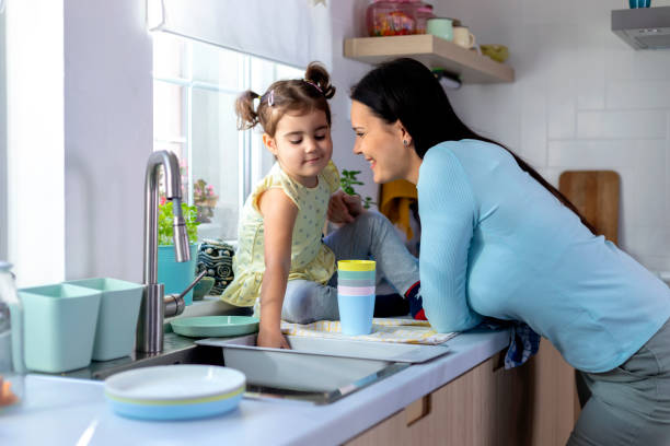 istock Mother and daughter in kitchen 1376125642