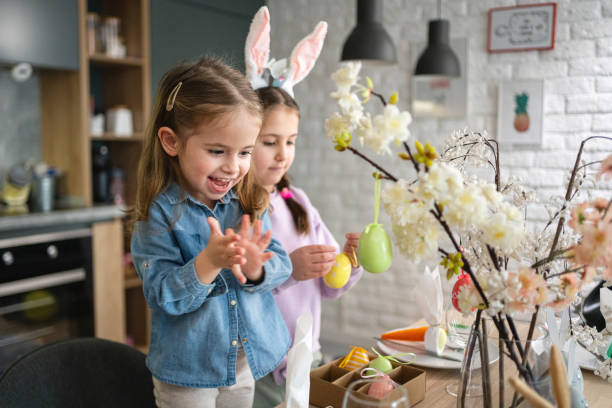 istock Cheerful Caucasian sisters, decorating the table for an Easter lunch 1376125958