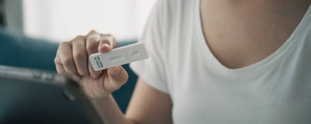 istock Woman using COVID-19 ag test kit. 1376132516