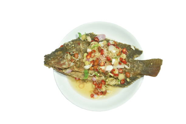 istock fried mango fish dressing spicy sauce herb sauce 1376139153