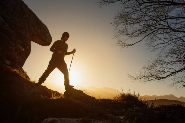 istock silhouette of man making a journey through the mountain 1376143173