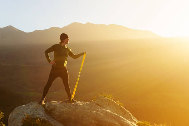 istock man on a rock in the mountains, 1376143783