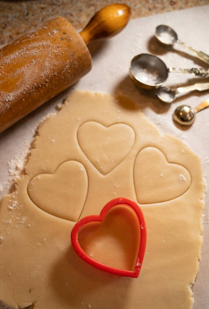 istock Heart Shaped Cookie Cutter with Cookie Dough and Baking Items 1376151818