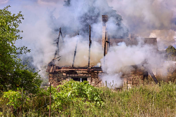 istock extinguishing the fire destroyed the village house 1376167963