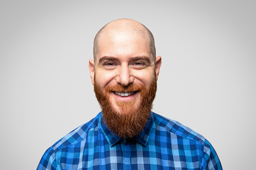 Portrait of young handsome smiling man