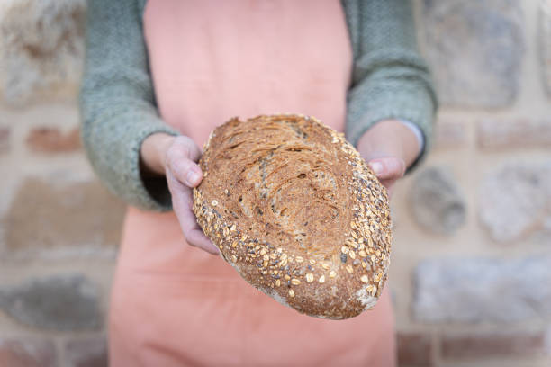 istock Woman holding freshly baked bread 1376168987