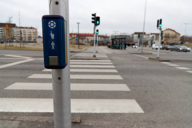 Halmstad, Halland, Sweden - March 1, 2022: Image was taken in the midday of 1st Mach 2022, in the center of the city. Image presents sound marked pedestrial road crossing with zebra and sound making device. Help for disabled people with sight issues. Accessibility of the urban space.
