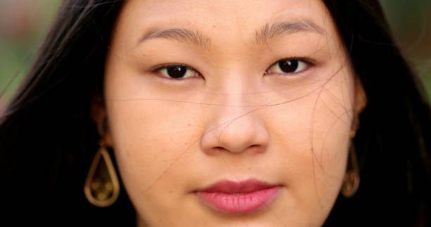 istock Asian young larger woman close-up face looking at camera 1376173651