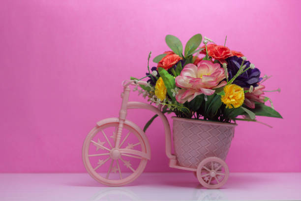 istock Miniature pink bicycles on pink background 1376176294