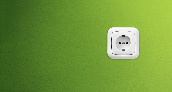 Double socket with earthing on a gray background top view