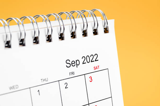 September 2022 desk calendar on yellow background. Close-up September 2022 desk calendar on yellow background. september calendar stock pictures, royalty-free photos & images
