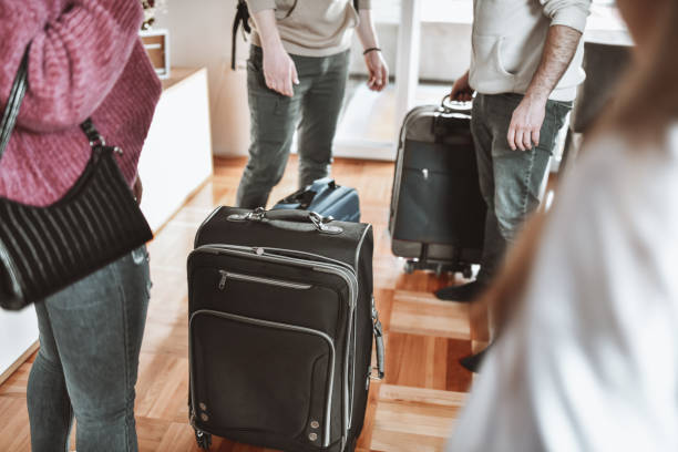 istock Couples Preparing Big Traveling Luggage For Trip 1376189261