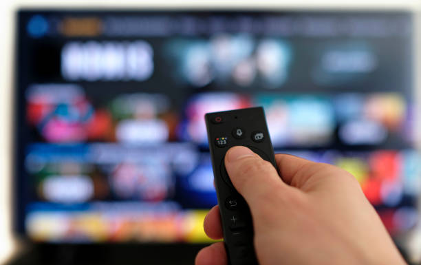 binge watching the favorite tv show - loading imagens e fotografias de stock