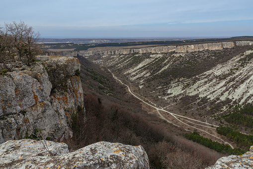 View of valley and mountain Besh-Kosh from plateau Burunchak near cavetown Chufut-Kale in spring. Bakhchysarai, Crimea