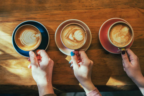 istock Holding cups of beautiful latte art. 1376238519