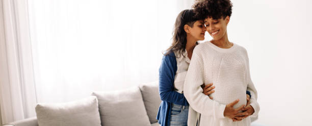 istock Expectant lesbian couple bonding at home 1376253006