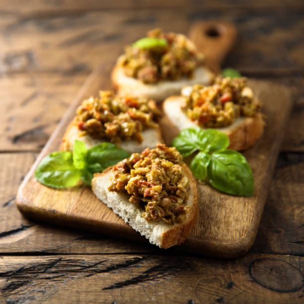 bruschetta with tapenade - caper sauce imagens e fotografias de stock