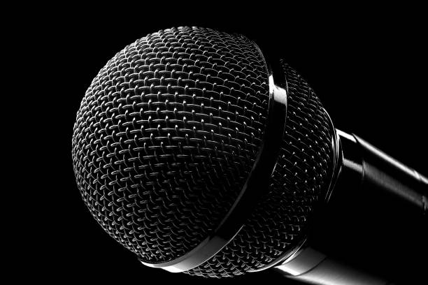 istock Round concert microphone close-up on black background. Musical equipment for performers. Topic of broadcasting 1376275987