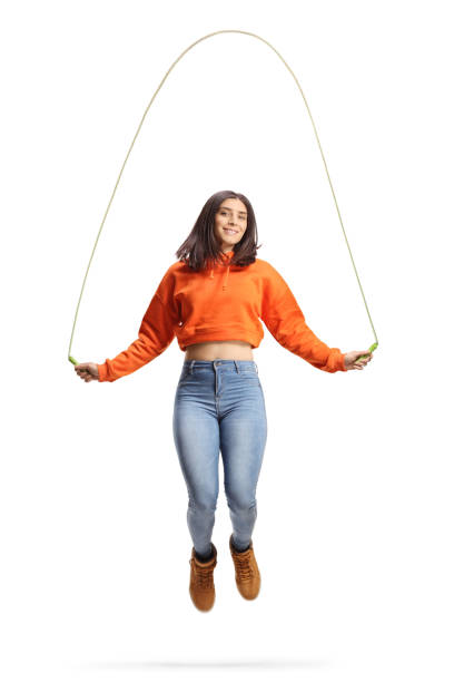 istock Trendy young female skipping a rope 1376283220