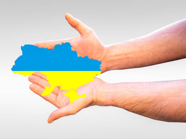istock Hands with Ukraine Map Symbolic 1376289223
