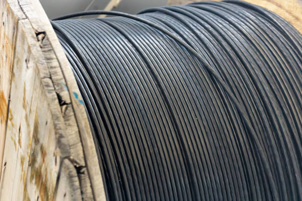 istock New blue power cable is wound on wooden coil. Background 1376299155