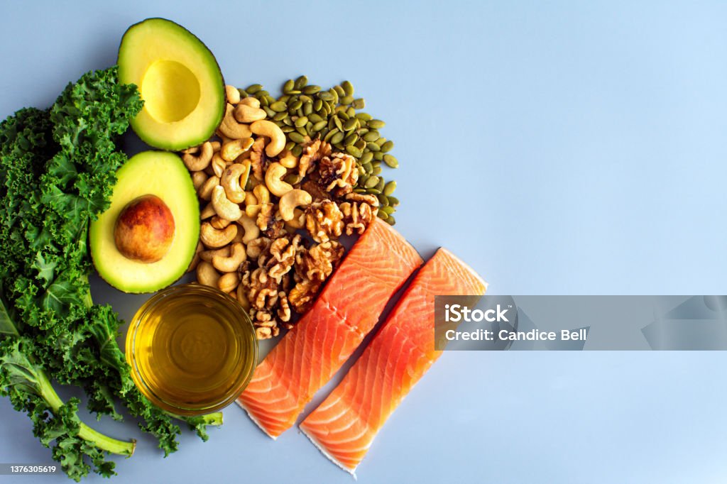 Overhead View of Fresh Omega-3 Rich Foods A variety of healthy foods like fish, nuts, seeds, fruit, vegetables, and oil rich in omega-3 nutrients Healthy Eating Stock Photo