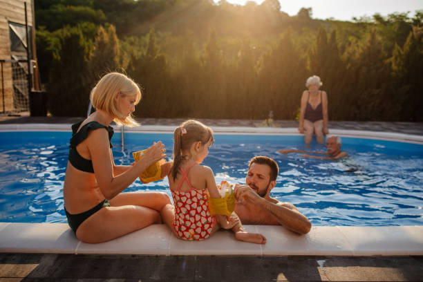 istock Putting on inflatable safety sleeves for swimming 1376313807