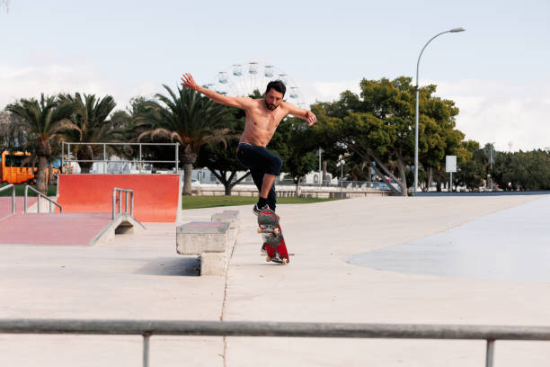 istock Skateboarder doing a trick in a skate park 1376316000
