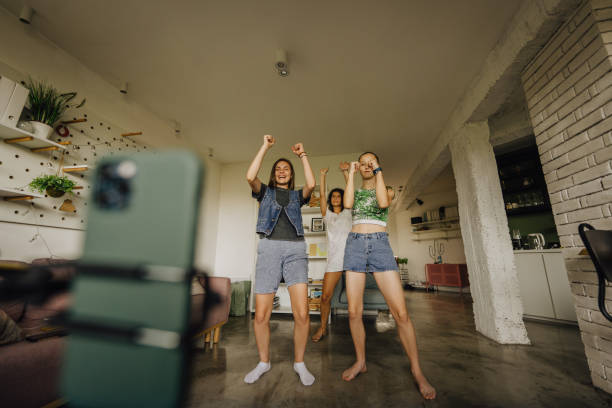 Young influencers trying out viral internet challenges stock photo