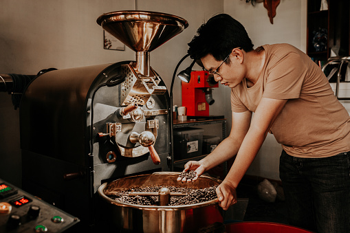 A young asian coffee roaster is using a professional roaster to roast coffee
Specialty Coffee
Coffee Machine
Coffee Roastery