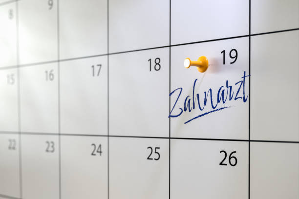 Dentist appointment concept in German. A calendar with an entry "Zahnarzt" (Dentist) and a thumbtack. Selective focus. Dentist appointment concept in German. A calendar with an entry "Zahnarzt" (Dentist) and a thumbtack. Selective focus. zahnarzt stock pictures, royalty-free photos & images