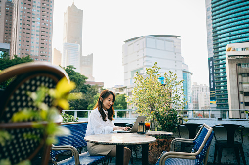 Asian business woman working at coffee shop