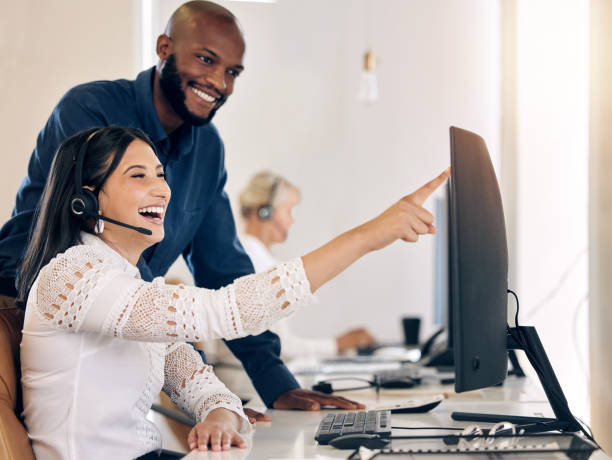 istock Shot of two call centre agents working together on a computer in an office 1376355623