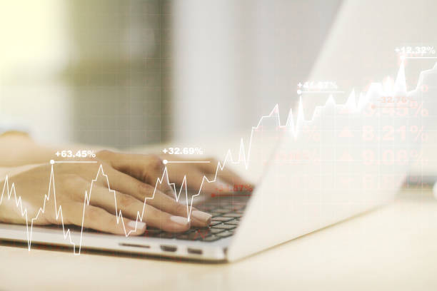 istock Multi exposure of abstract creative financial chart with hand typing on computer keyboard on background, research and analytics concept 1376360098