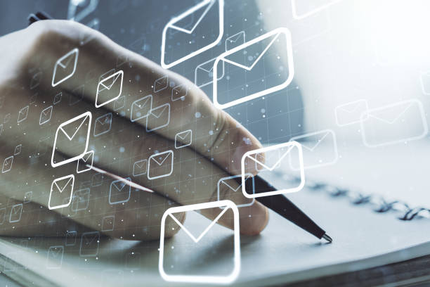 istock Creative abstract postal envelopes hologram with hand writing in diary on background, email and notification concept. Multiexposure 1376360633